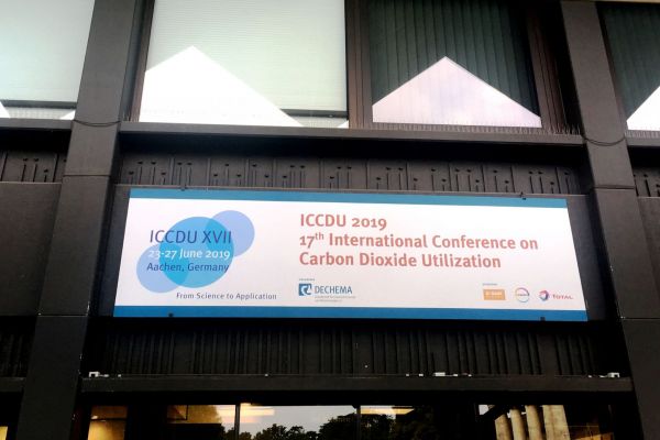 Th entrance with a poster to the ICCDU conference is visible. 